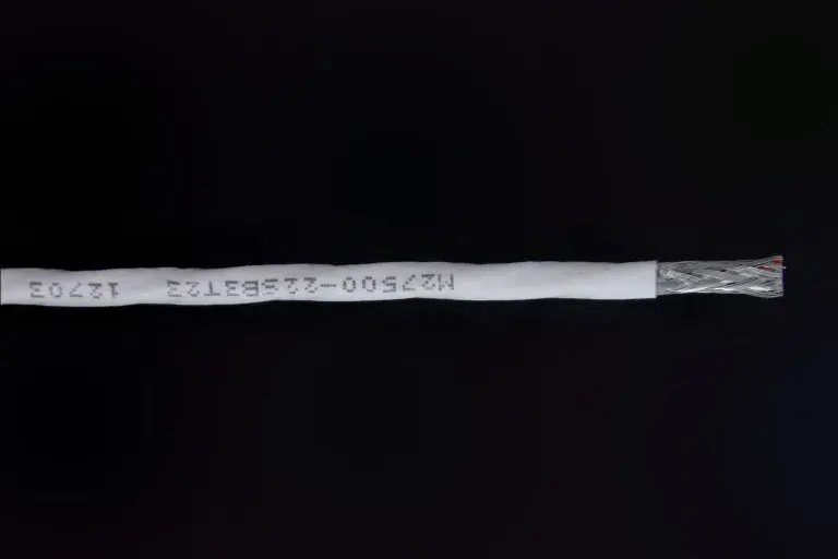 M27500-22SB3T23 12703 white colored wrapper for black wire.