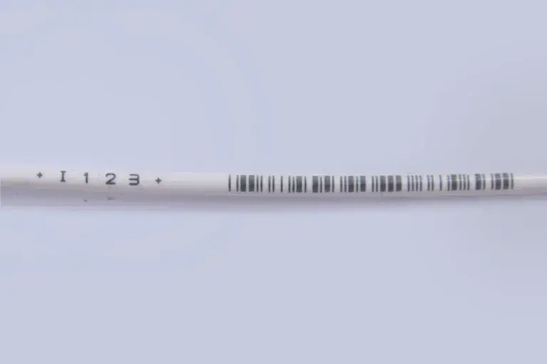 I 1 2 3 Black lines on white colored wrapper.