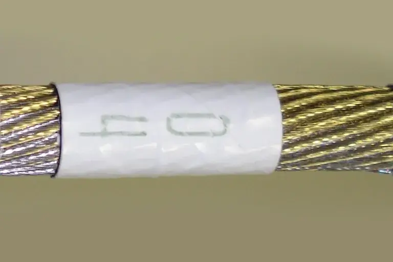 04 white colored wrapper for golden wire.